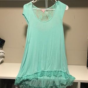 Teal/Mint colored top.